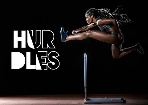 woman going over hurdles