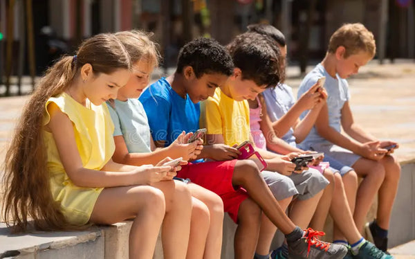 kids-using-phones-outdoors-concept-children-addiction-to-social-network-kids-using-phones-outdoors-concept-children-246212998.webp__PID:70b93c1f-a5e1-4c15-a221-39ea8cc66c01