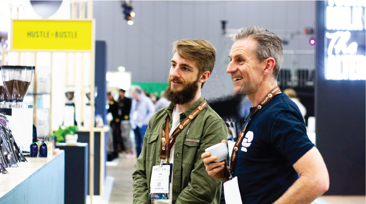 Joe chatting with team from La Marzocco at True Artisan Cafe stand at MICE or Melbourne International Coffee Expo