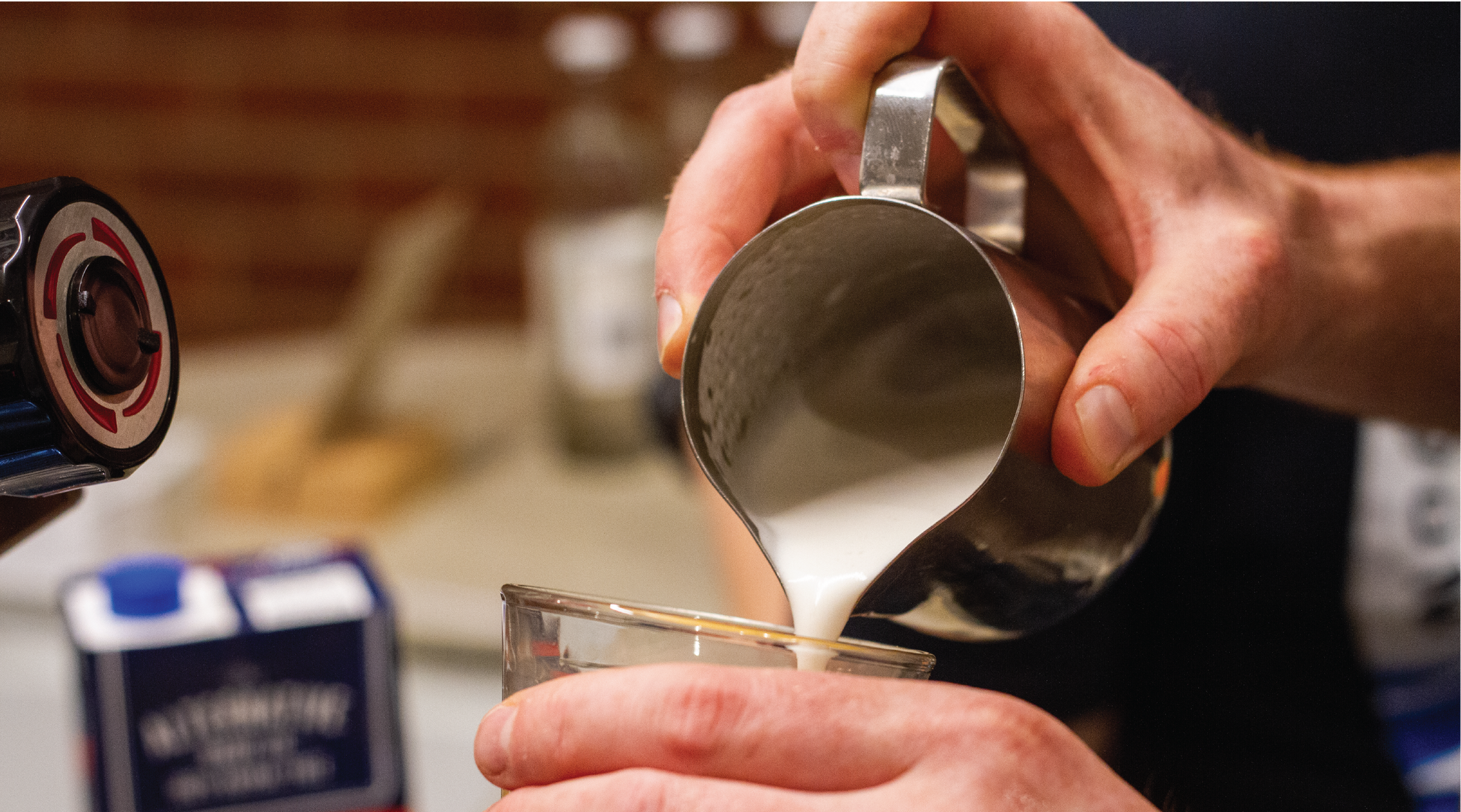 Pouring a coffee at the Rumble coffee roasters espresso bar in Kensington, using an alternative dairy milk