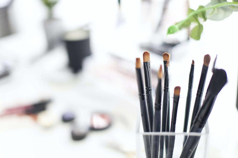 Makeup Brushes Against Bright Background