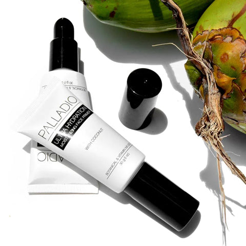 Ultra Hydration Primer product laid on white background with fresh raw coconuts.