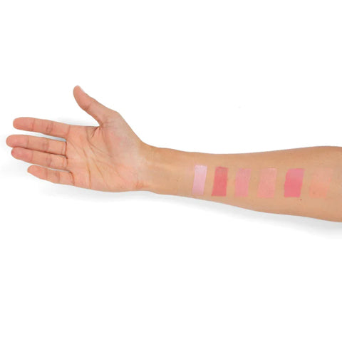 Arm with all 6 swatches of I'm Blushing 2-in-1 Cheek and Lip Tint on white background