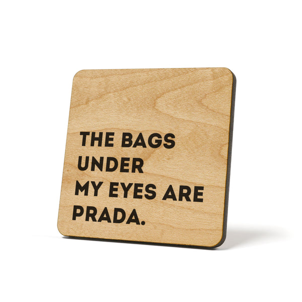 The bags under my eyes are Prada. Quote Coaster – American Brand Studio