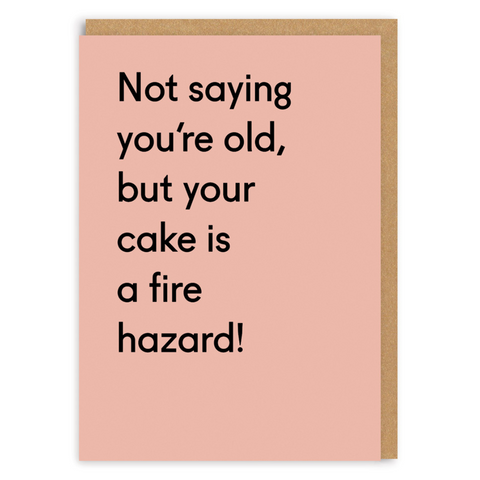 birthday card with the text: 'Not saying you're old, but your cake is a fire hazard!' on a peach background
