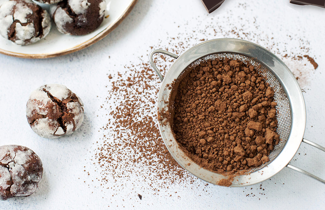 Pascha Cocoa Powder in Sieve with Chocolate Cookies