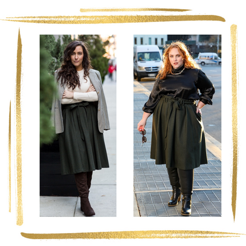 woman on left wears plaid light brown jacket over ivory sweater with olive green knee length skirt with 3 pleats and paperbag pleating at waistline and matching belt tied in a bow. womn on right wears same skirt with flowy black blouse and gold chunky necklace