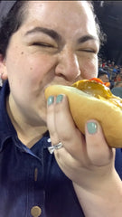 eating hot dog in denim dress