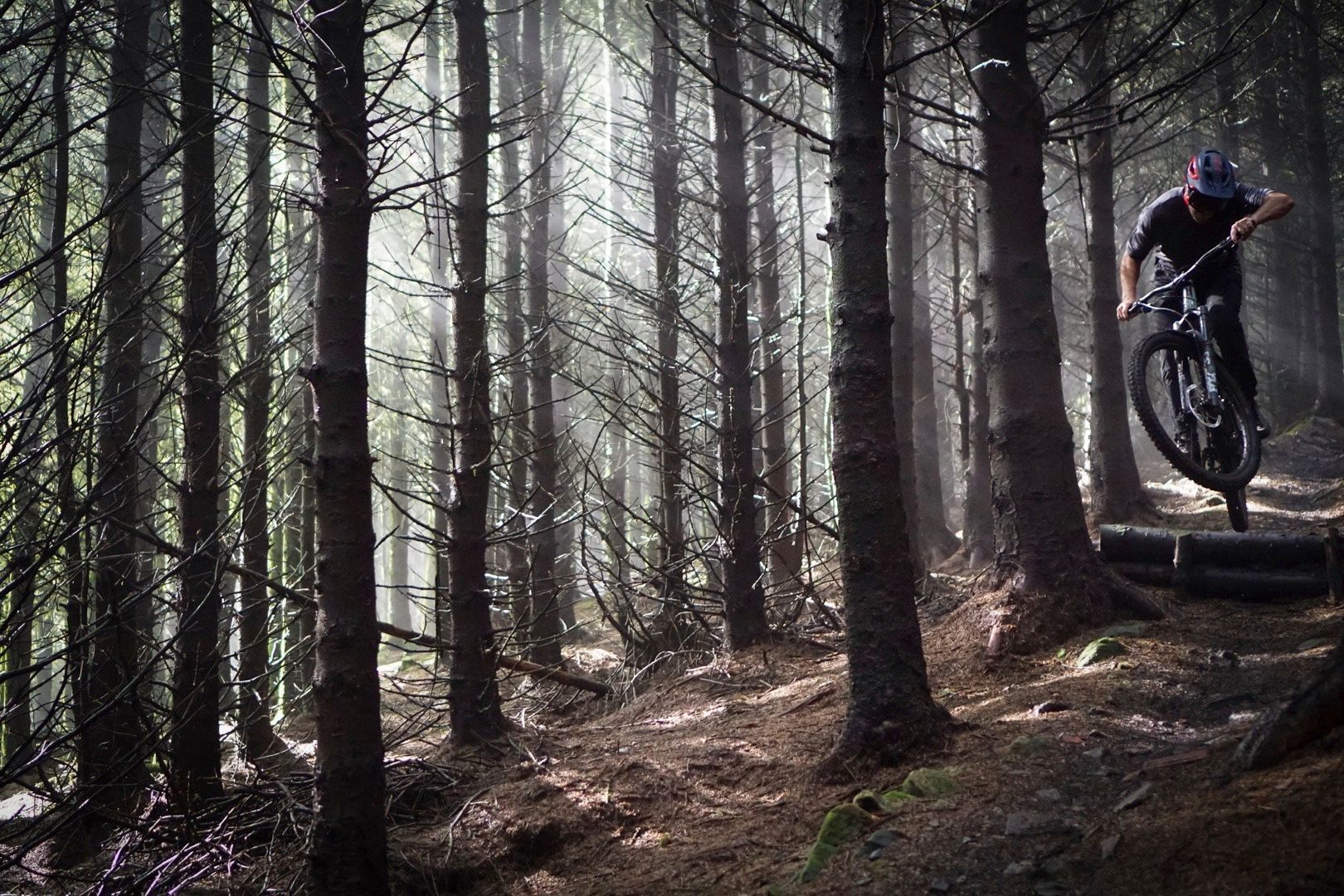 Singletrack rider testing the Privateer 141 on a trail