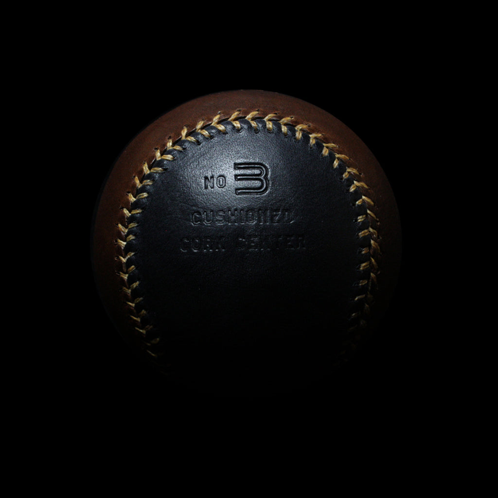 View of "No 3" embossed into the black leather of the Warstic Official #3 Sandlot Baseball