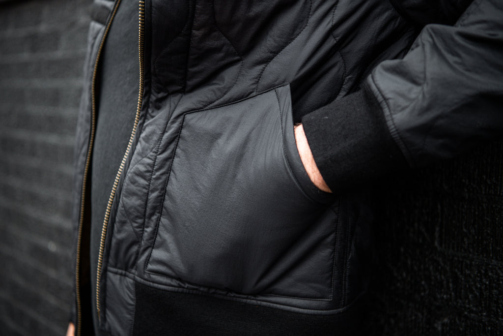 View of the front pockets of the Warstic x Billy Reid Icon Player's Jacket