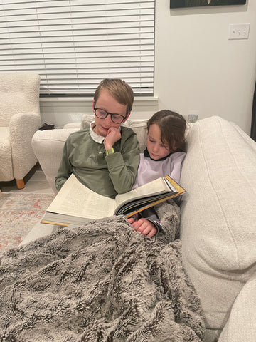 two children reading together