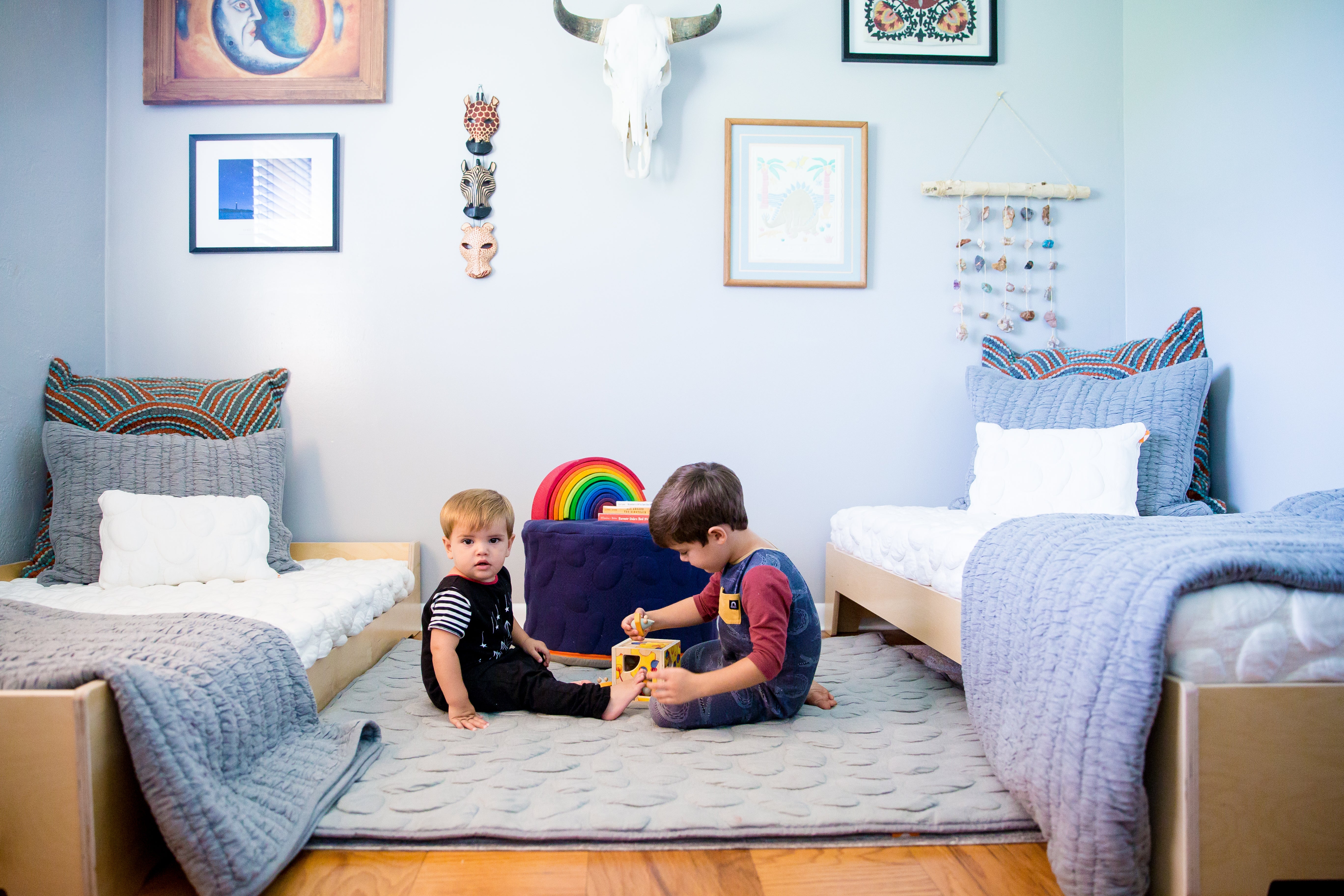 children in room with floor bed