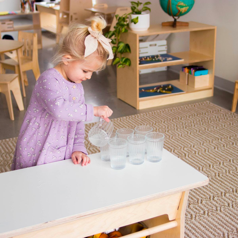 Child pouring water