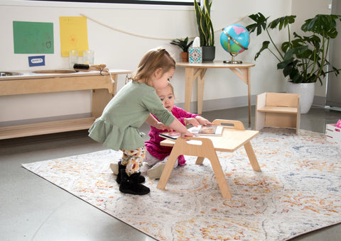 Child using a floor desk