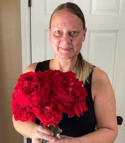 Vitauthority Team Member Angela with roses picked from her own garden.