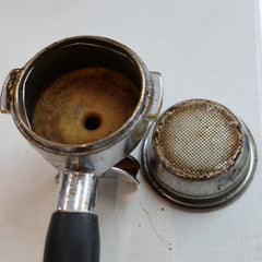 Dirty espresso handle and basket, Three Llamas Coffee