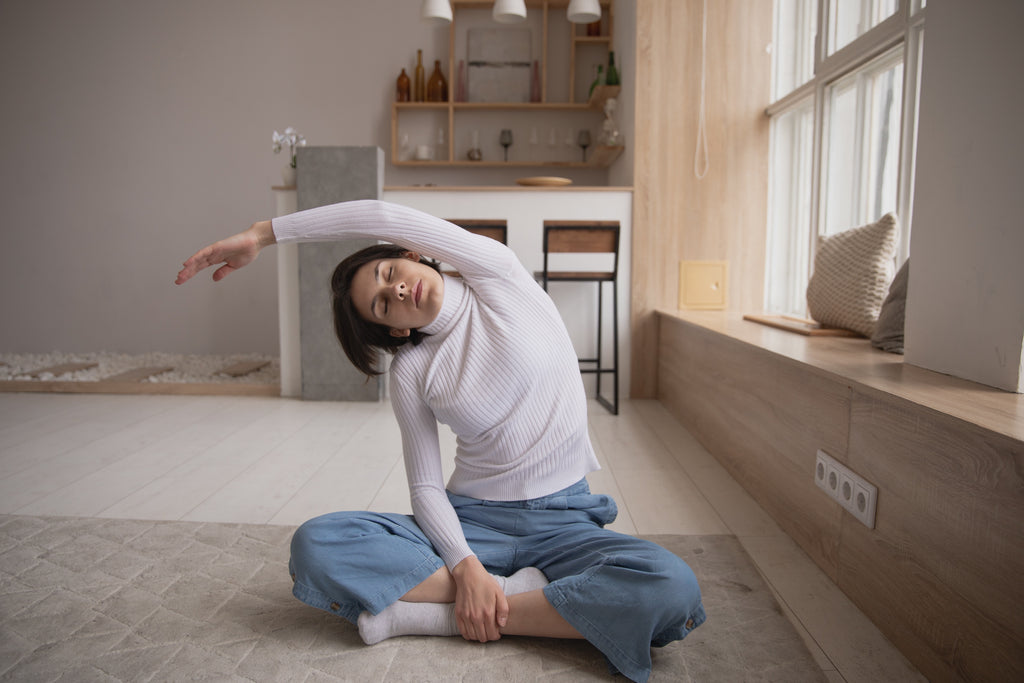 Image of woman stretching and meditating