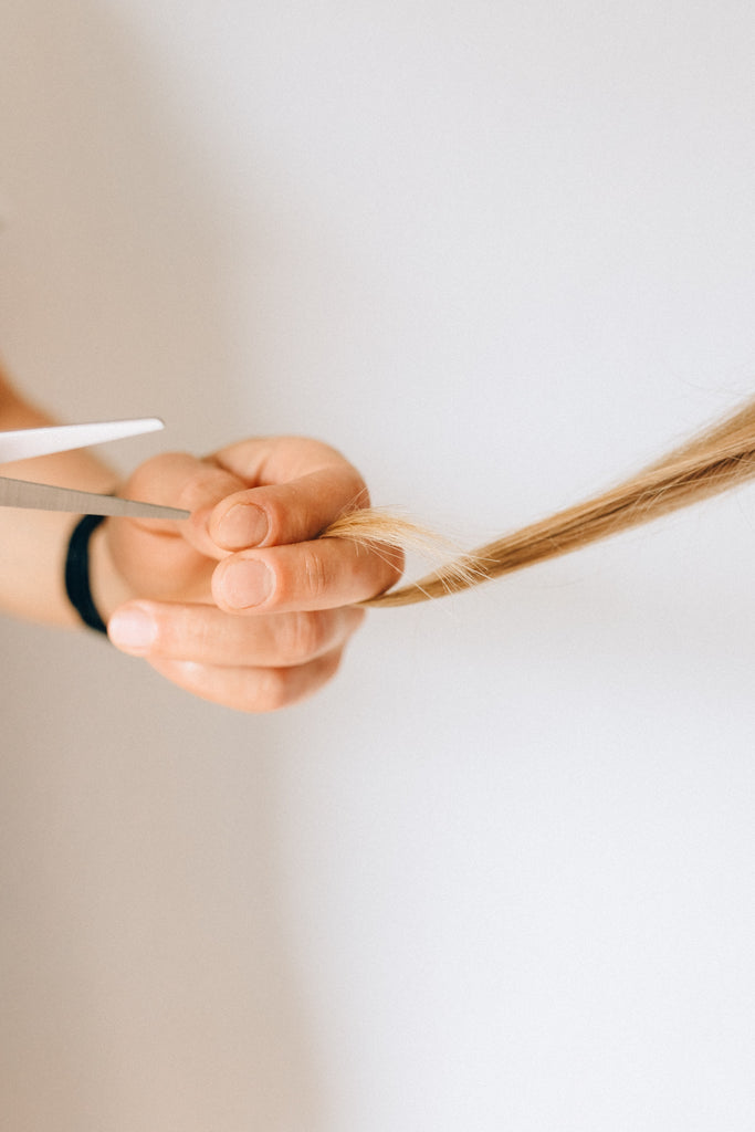 Image of woman cutting hair