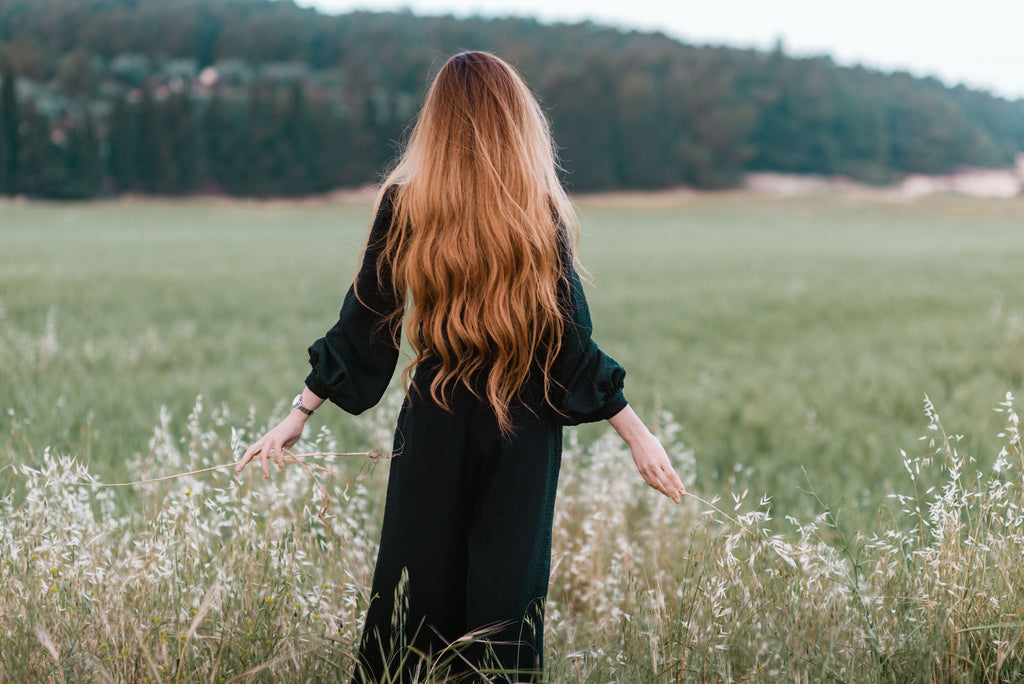 Image of woman with long hair in field