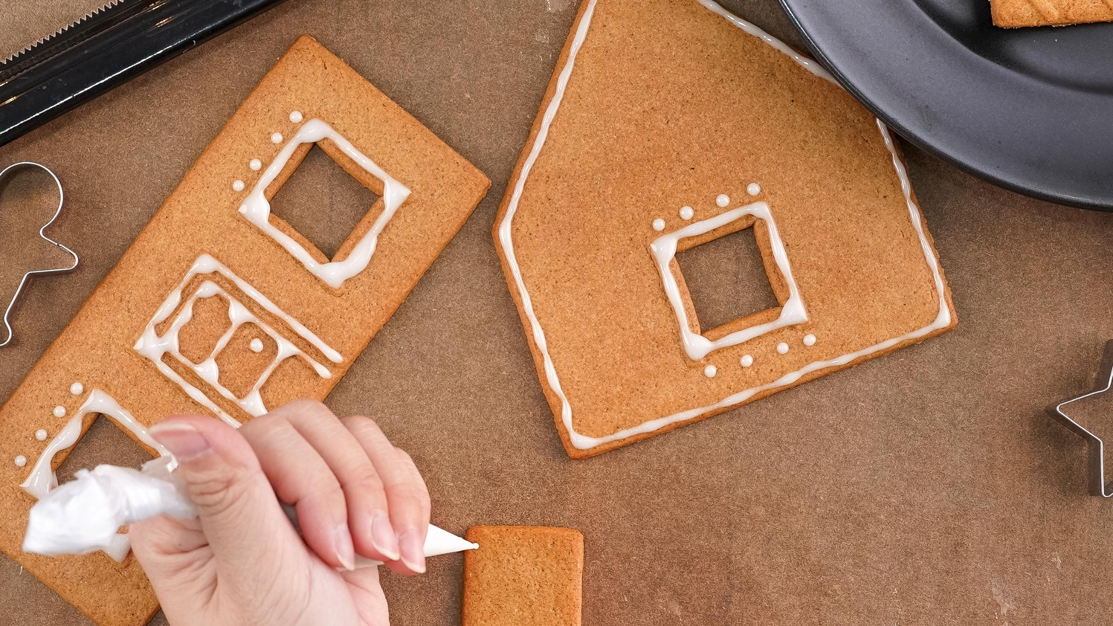 decorating the parts of a gingerbread house