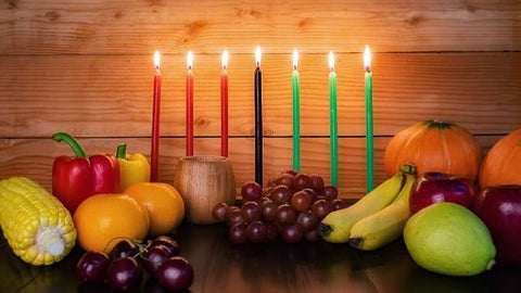 Kwanzaa candles and harvest vegetables
