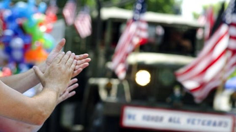 hands clapping at patriotic parade united states