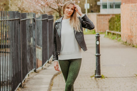Green dapple leggings styled with a leather jacket