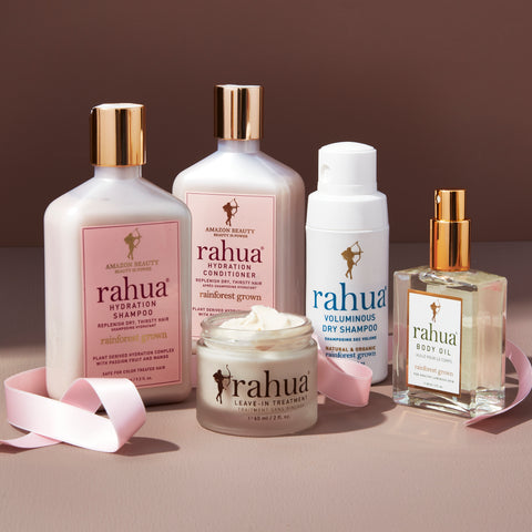 Rahua hair care products on the table with pink ribbon