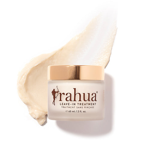 Rahua leave in treatment container with the creamy product texture in background