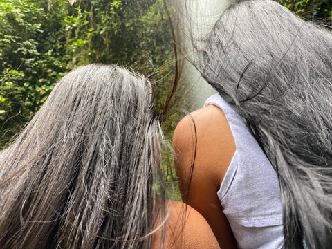 Two women with opened straight and silky hairs
