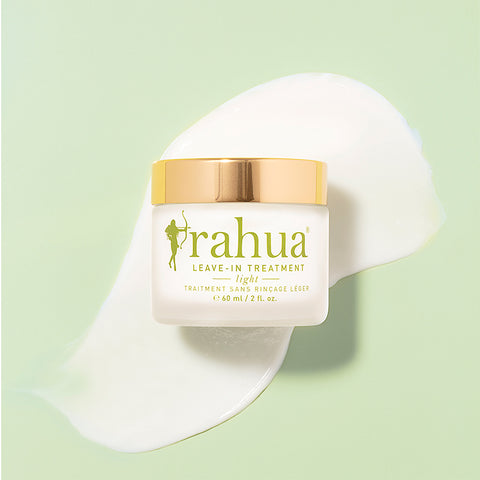 Rahua leave in treatment light box with the creamy product texture in background