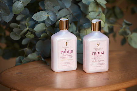 Rahua Hydration shampoo and conditioner set placed on the table 