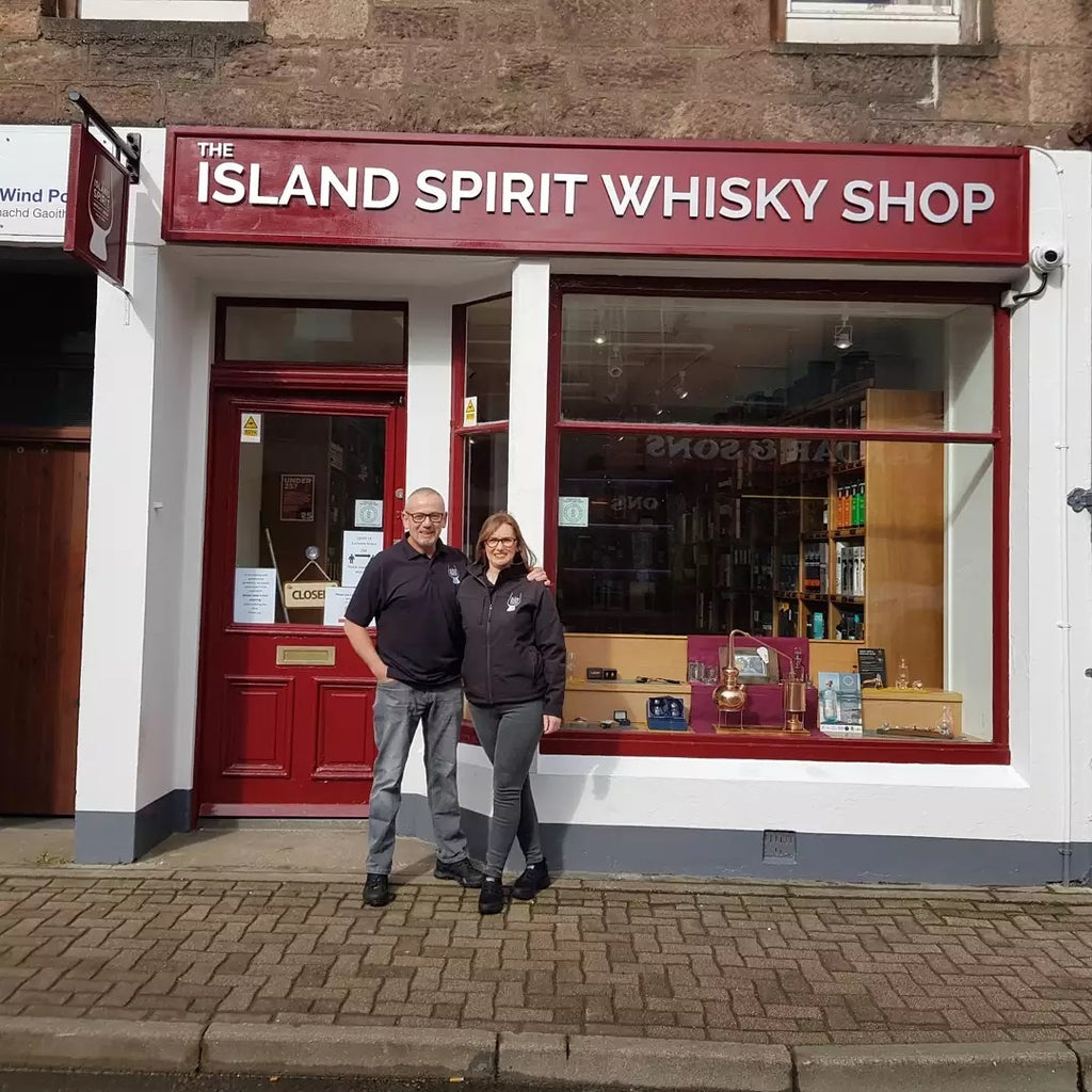 Iain and Mary outside The Island Spirit WhiskY Shop in Stornoway