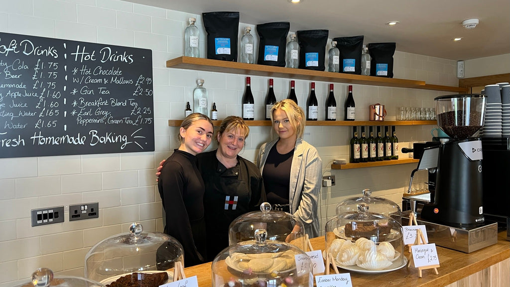 Emma, Irene, and Sarah keep the coffee flowing and their café counter well stocked.