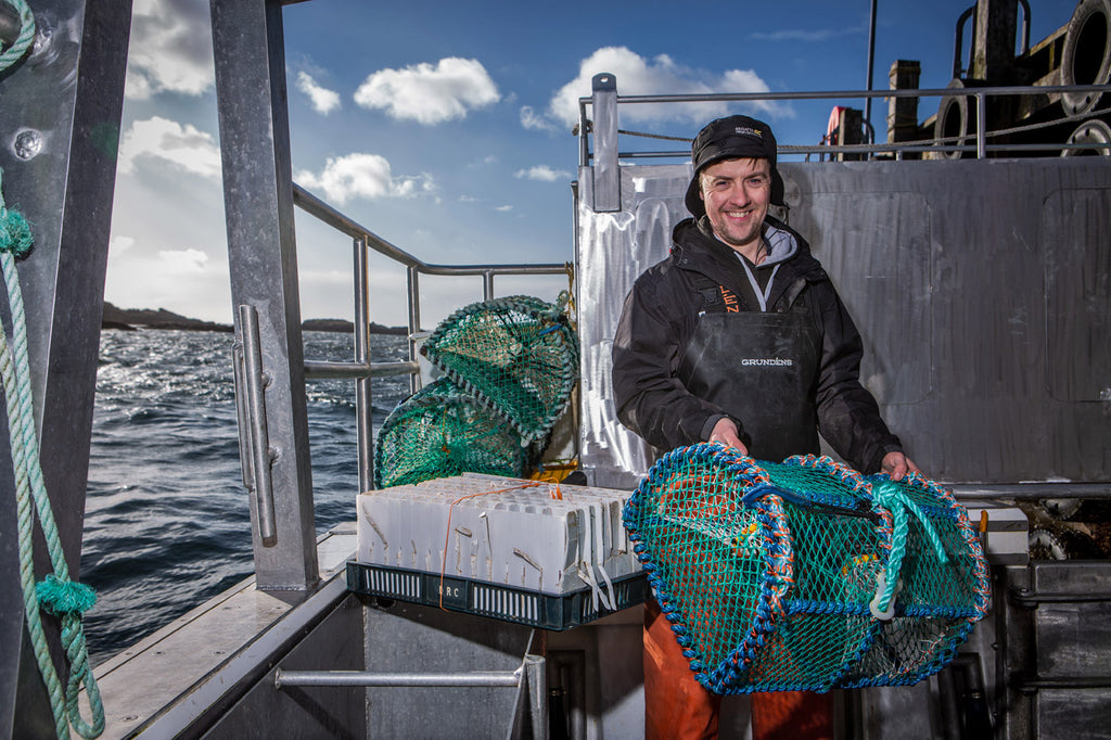 Donald setting creels at sea with a smile on his face.