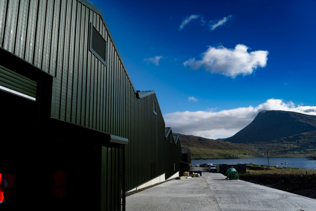 Blue skies above the new warehouses in Ardhasaig.