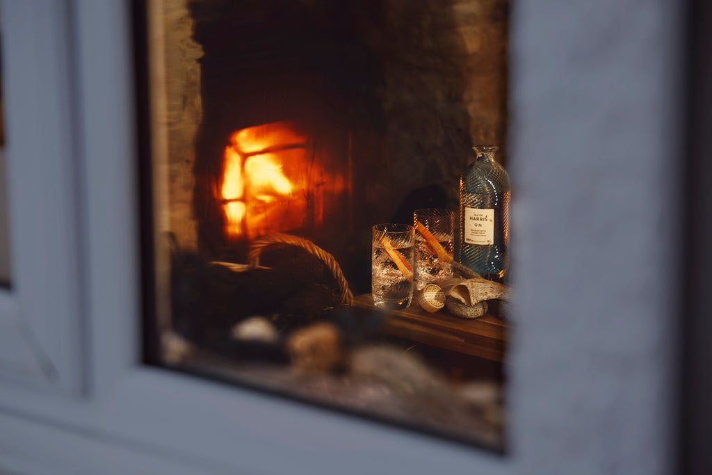 A blaze burning in a Harris hearth, with warmth awaiting inside.