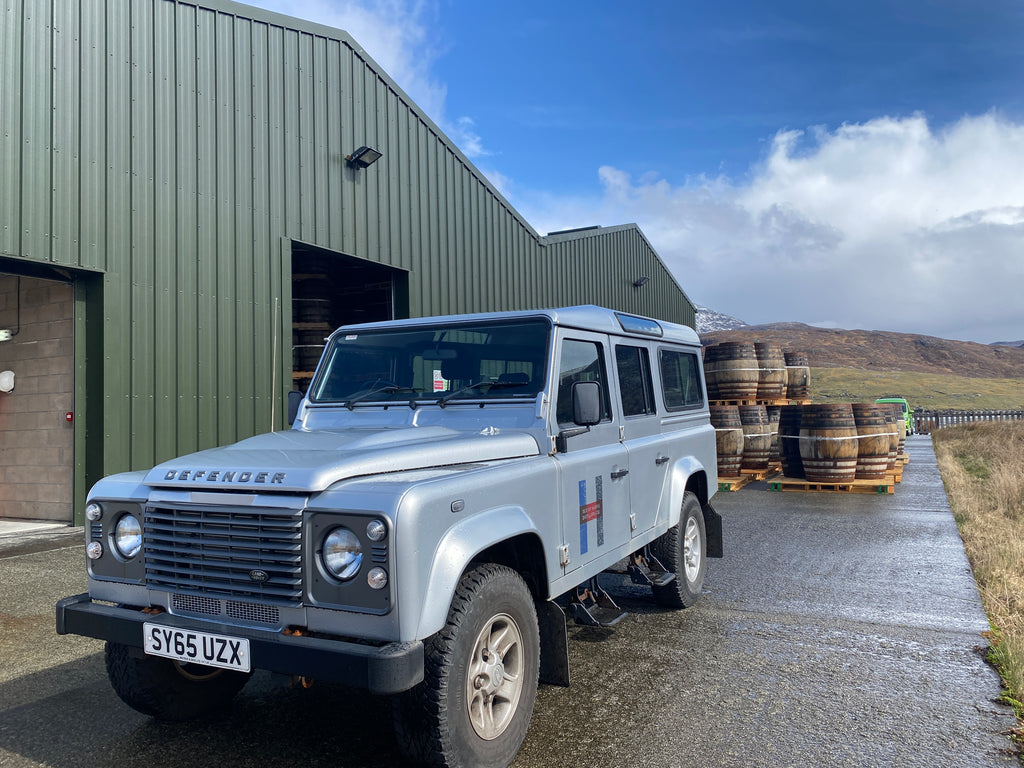 Whisky barrels under blue skies one minute...