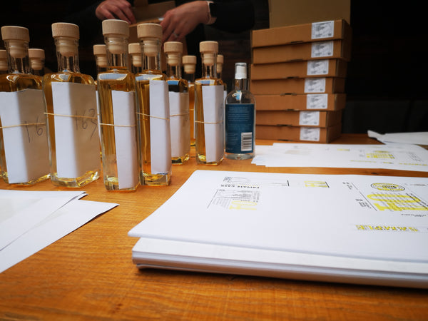 Hand-written labels, each signed by the Head Distiller...