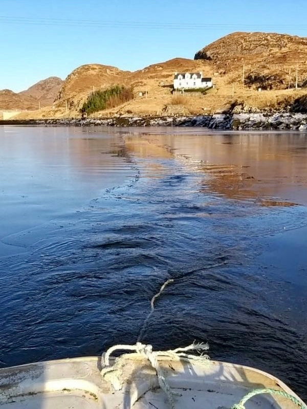 Local fishing boat, the 'Lead Us', breaks through the thawing ice at Stockinish. Image  © Marie M Morrison.