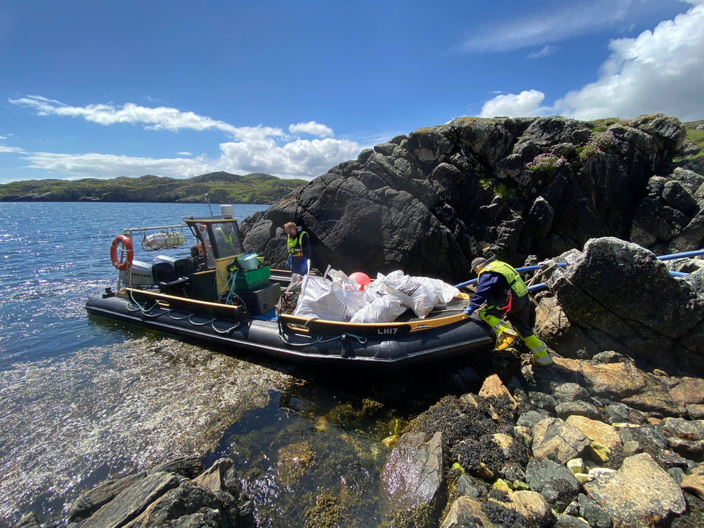 The first boatload of plastic debris is removed from our remote clean-up location.