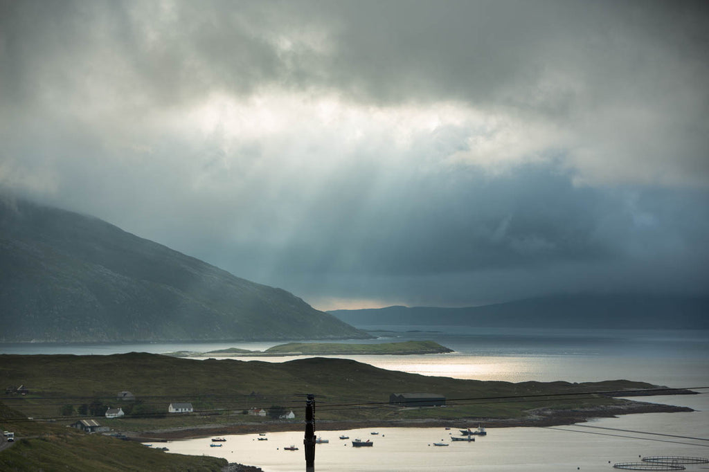 Sun rays as we look over to the cask warehouses at Ardhasaig