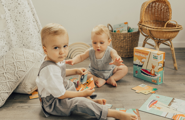 Baby and toddler playing