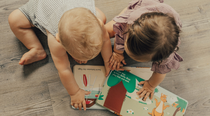 Baby exploring their books