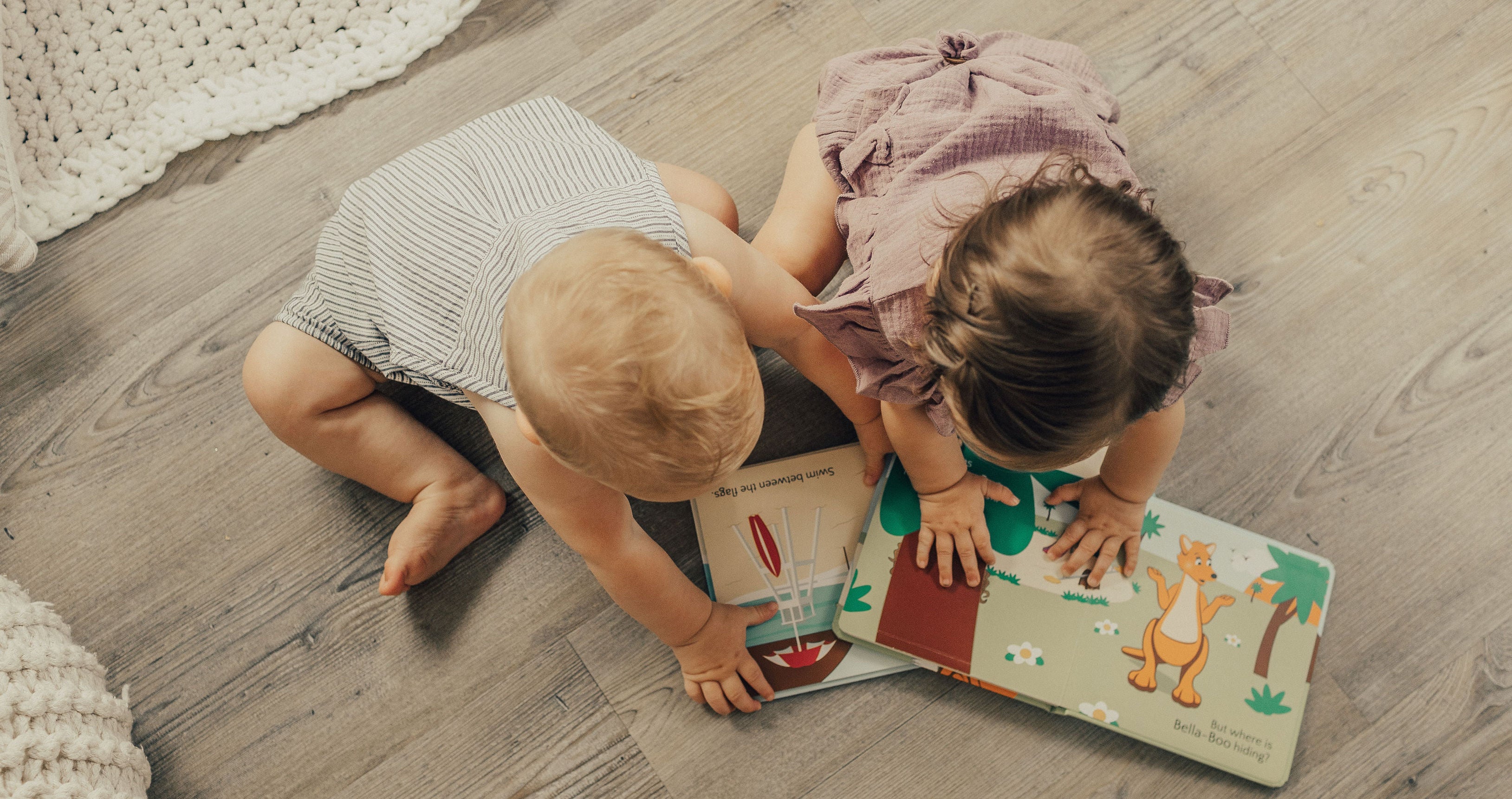 Babies reading Mizzie interactive books