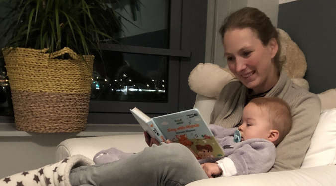 Mom reading to a baby, bedtime reading