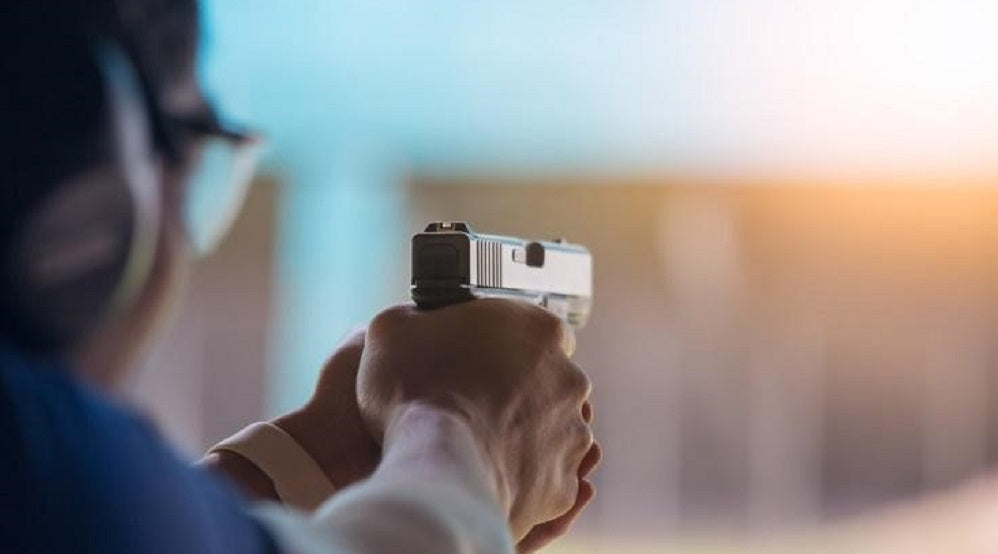 A man aiming a pistol