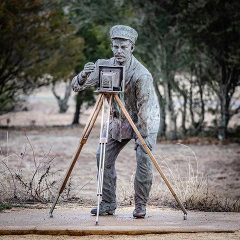 sculpture of photographer from early 1900's