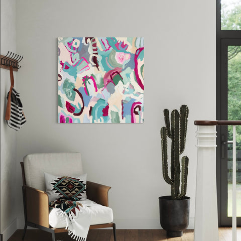 pink and neutral acrylic abstract painting hung on wall in entryway by cactus. boho design decor and neutral minimalist